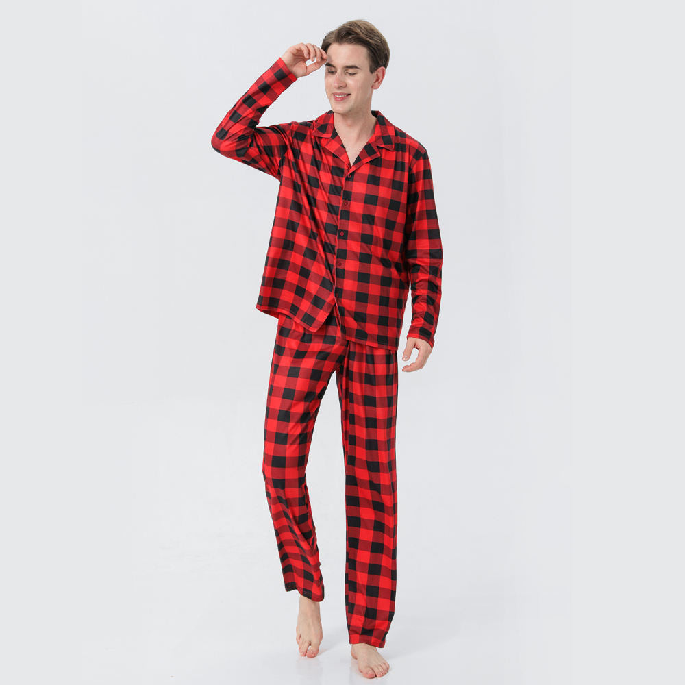 Person wearing a red and black checkered pajama set on a white background